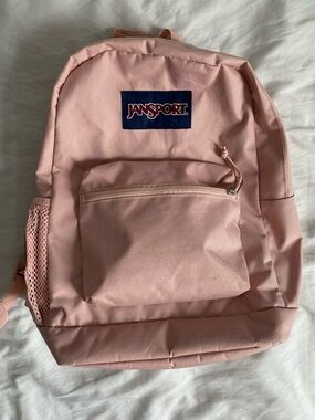 Jansport Light Pink Backpack with Navy Logo Patch